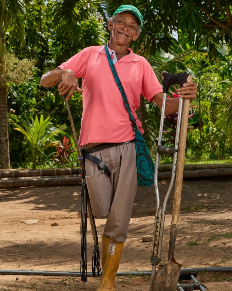 Field worker holding tools